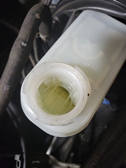 Dirty Brake Fluid Reservoir - Seiko's Auto Service Inc.