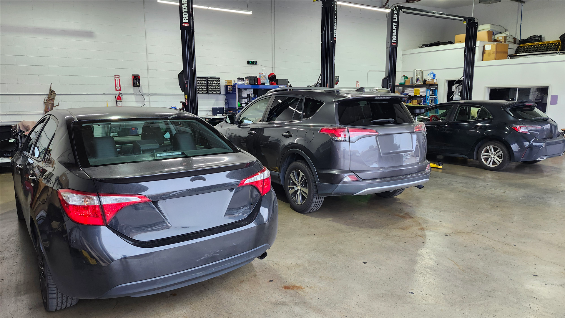Toyotas being serviced inside Seiko’s Auto Service shop